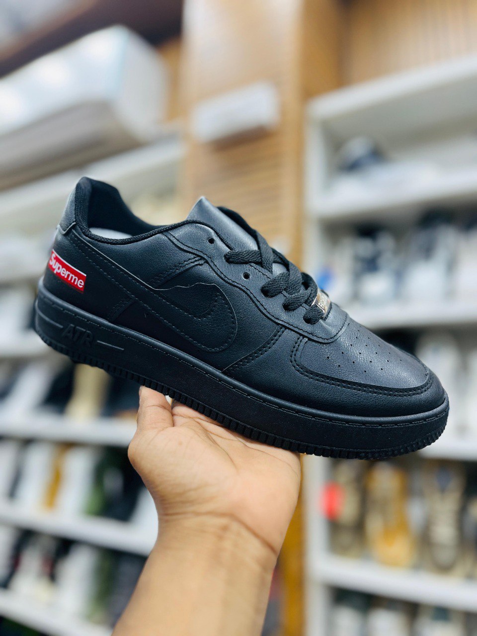 Nike x Supreme Low-Top Sneaker with Red Logo Accent -