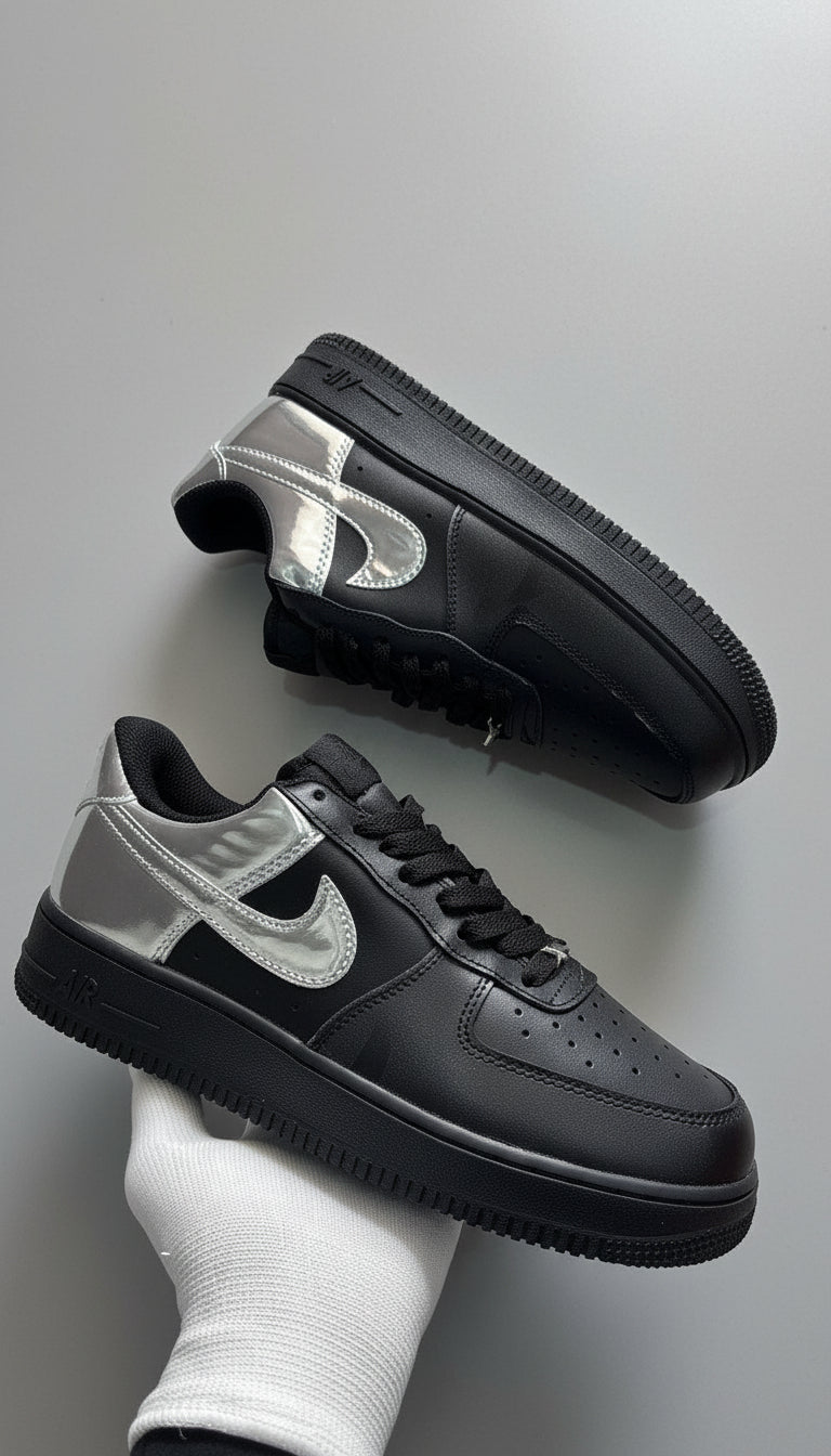 Black and gray sneakers on a concrete floor